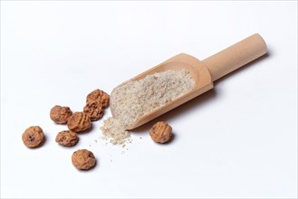 Tigernuts and tigernut flour in wooden shovel