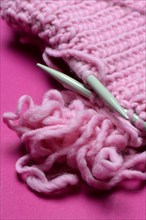 Knitted wool with knitting needles