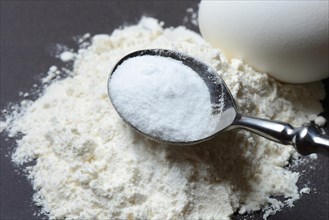 Spoon with baking soda and flour and egg