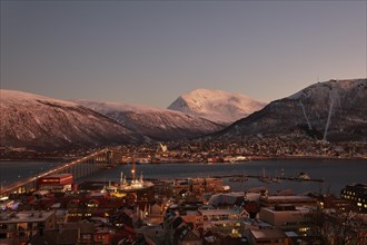View of the harbour and the city with Tromso Bridge and Ice Sea Cathedral