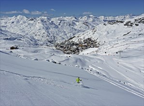 Skier skiing in deep snow