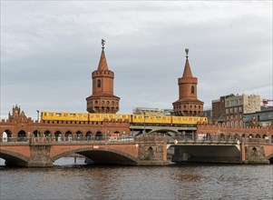 Yellow S-Bahn on the Oberbaum Bridge between Kreuzberg and Friedrichshain