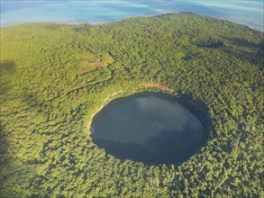 Aerial of Lalolalo lake volcanic crater lake