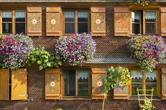 Facade of a Bregenzerwald house with flower decorations