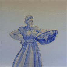 Azulejos representing a washerwoman in a former public wash house