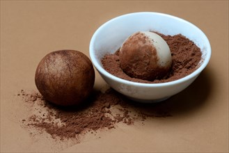 Marzipan potato in shell with cocoa
