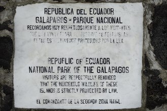 Old marble plaque with admonition to tourists