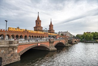 Yellow S-Bahn on the Oberbaum Bridge between Kreuzberg and Friedrichshain