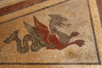 Mythical animals decorating walls in Estoi Palace garden