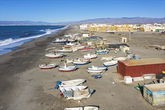 Fishing boats and fishermen cottages at the beach of San Miguel de Cabo de Gata