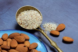 Ground almonds in ladle