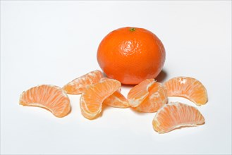 Clementine and pieces on white background