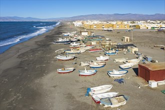 Fishing boats and fishermen cottages at the beach of San Miguel de Cabo de Gata