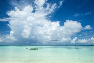 Little motorboat in the turquoise waters of the beautiful lagoon of Funafuti