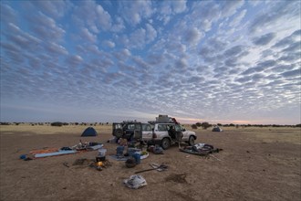 Camping under a dramatic morning sky in the Sahel