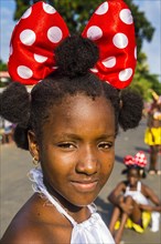 Girl posing at the Carneval in the town of Sao Tome