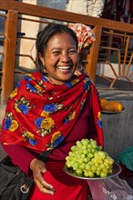 Women vendors selling grapes
