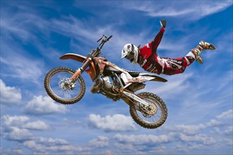 Motocross motorcycle and rider in the air