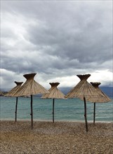 Straw parasols on the beach