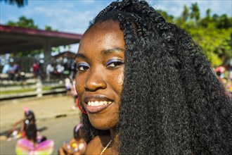 Girl posing at the Carneval in the town of Sao Tome