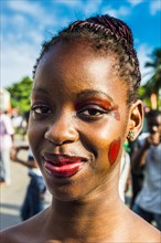 Girl posing at the Carneval in the town of Sao Tome