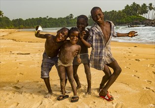 Young boys posing on a beach