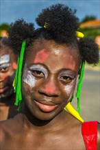 Girl posing at the Carneval in the town of Sao Tome