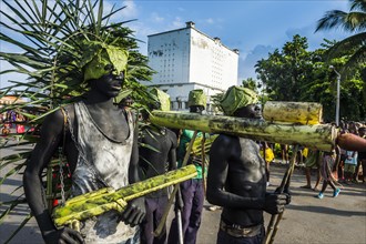 Martial looking weapons made of bamboo at the Carneval in the town of Sao Tome