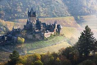 View of the Reichsburg Cochem in the Moselle valley in autumn
