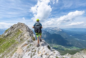 Climber on a ridge at a via ferrata