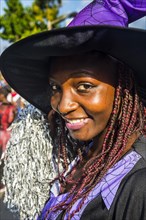 Girl posing at the Carneval in the town of Sao Tome