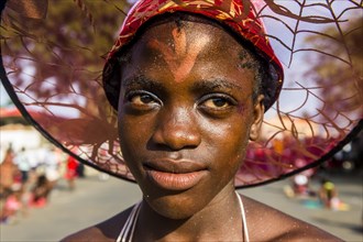 Girl posing at the Carneval in the town of Sao Tome