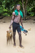 Man presenting his fresh caught squid