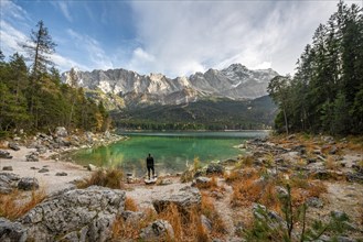 Young woman standing on the shore