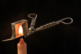Biedermeier wick scissors with burning candle