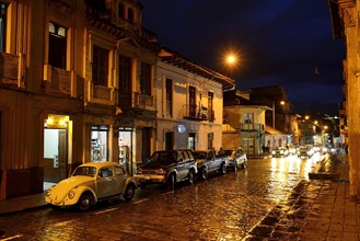 Wet street in the historical center at night