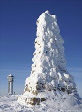 Snow-covered Bismarck monument and Feldberg tower