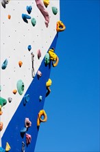 Handholds hooks and eyes on a climbing wall