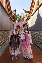 Local dressed women in the traditional Minnan-style houses