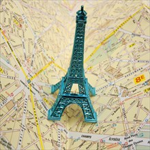 Eiffel Tower on city map of Paris