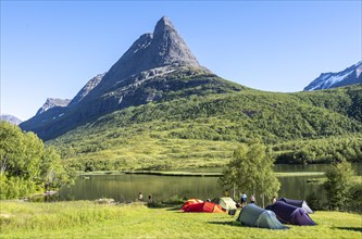 Tents on camping site by the lake Litlvatnet in the high valley Innerdalen