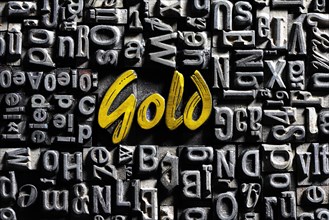 Old lead letters with golden writing