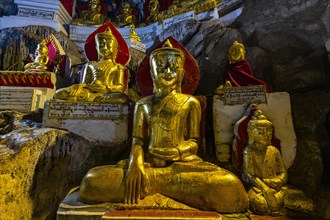 Gilded buddha images in the caves at Pindaya