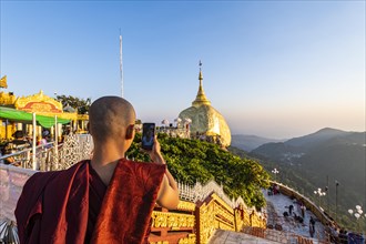 Monk photographing the Kyaiktiyo Pagoda