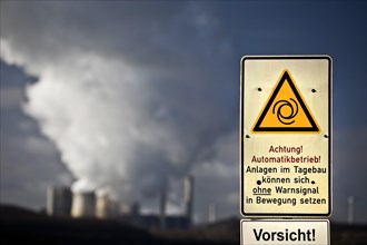 Sign with danger warning at the opencast mine Inden with power plant Weisweiler