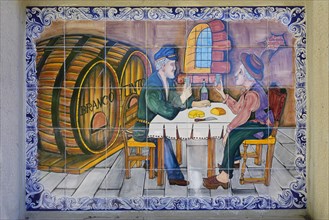 Funny painted tiles representing two men drinking wine