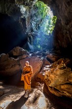 Monk standing in Saddan cave