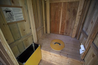 Interior view of a dry toilet at a hiker's cabin