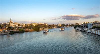 View over the river Rio Guadalquivir with excursion boats