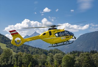 The OeAMTC rescue helicopter Christophorus 14 of the type Eurocopter 135 flies near its base in Oeblarn